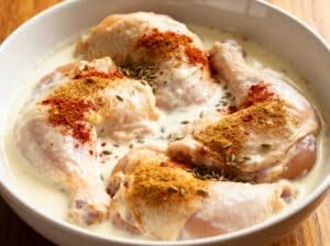 Close-up of steaming chicken biryani with saffron rice